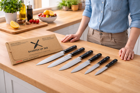 kitchen knives placed out on table preparing to be packaged up in mailer envelope